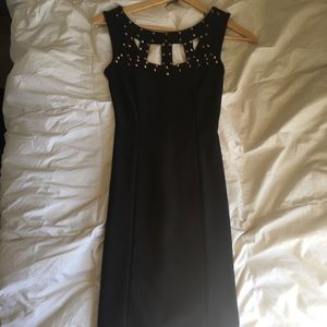 Tiny, black, tight dress.